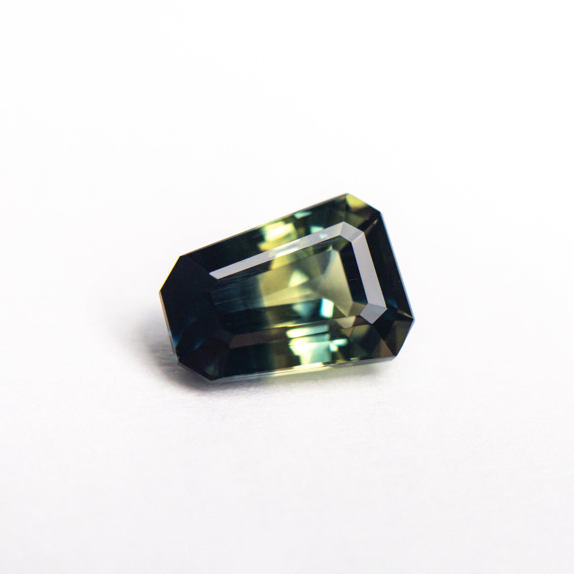 1.55ct 7.71x5.52x3.75mm Shield Step Cut Sapphire 25189-01